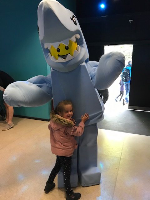 fun day out at Legoland UK with Kids - posing with a lego shark man