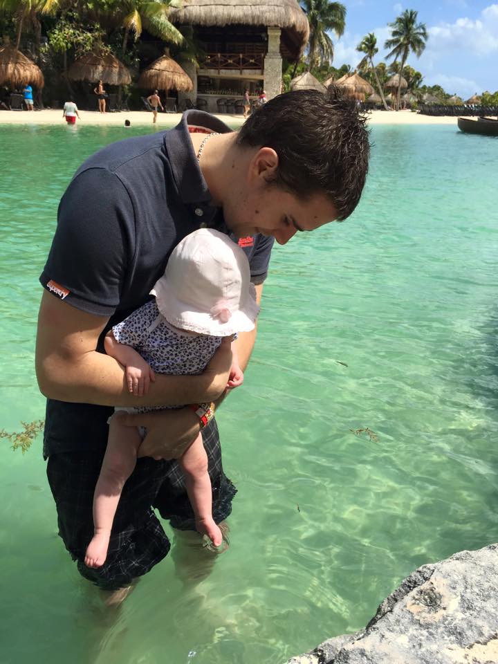 dad with baby in sea