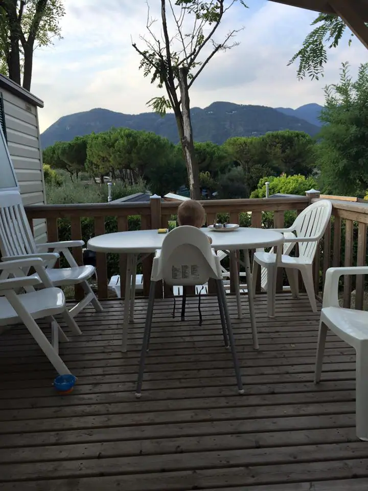 baby eating dinner on deck