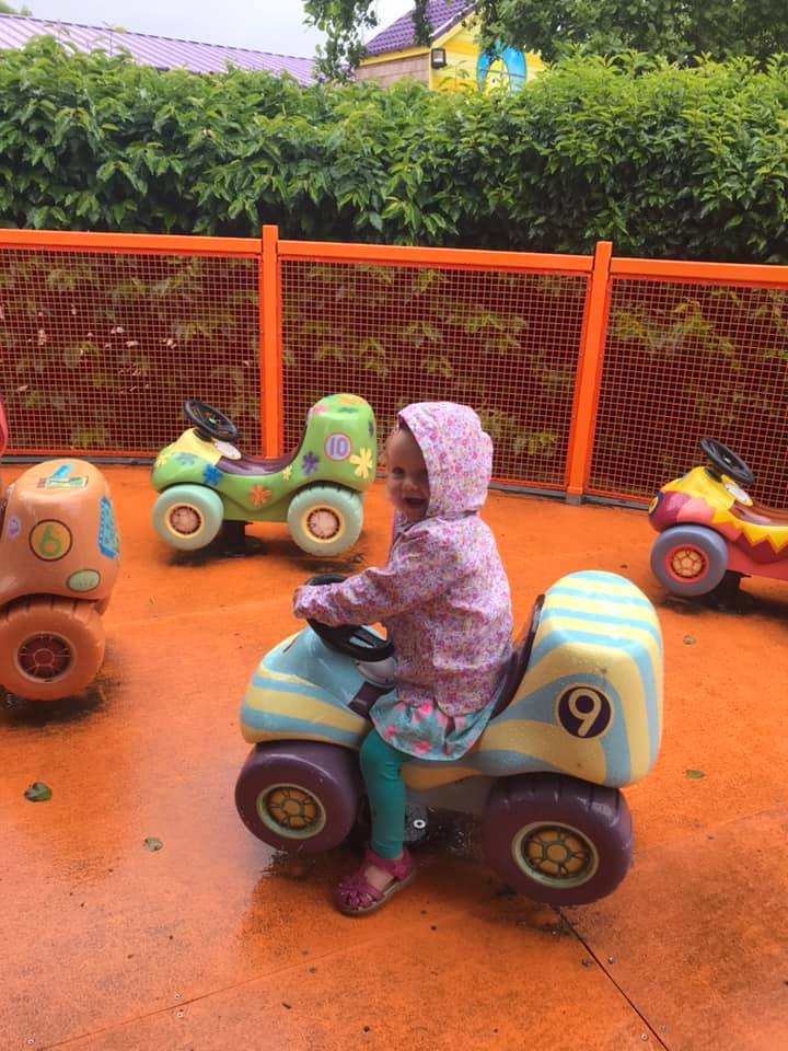 toddler on merry go round 