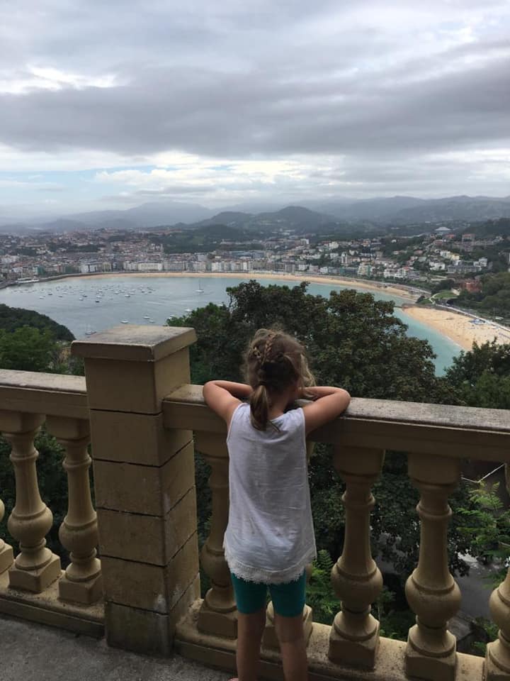 a girl looking at the view of San Sebastian 