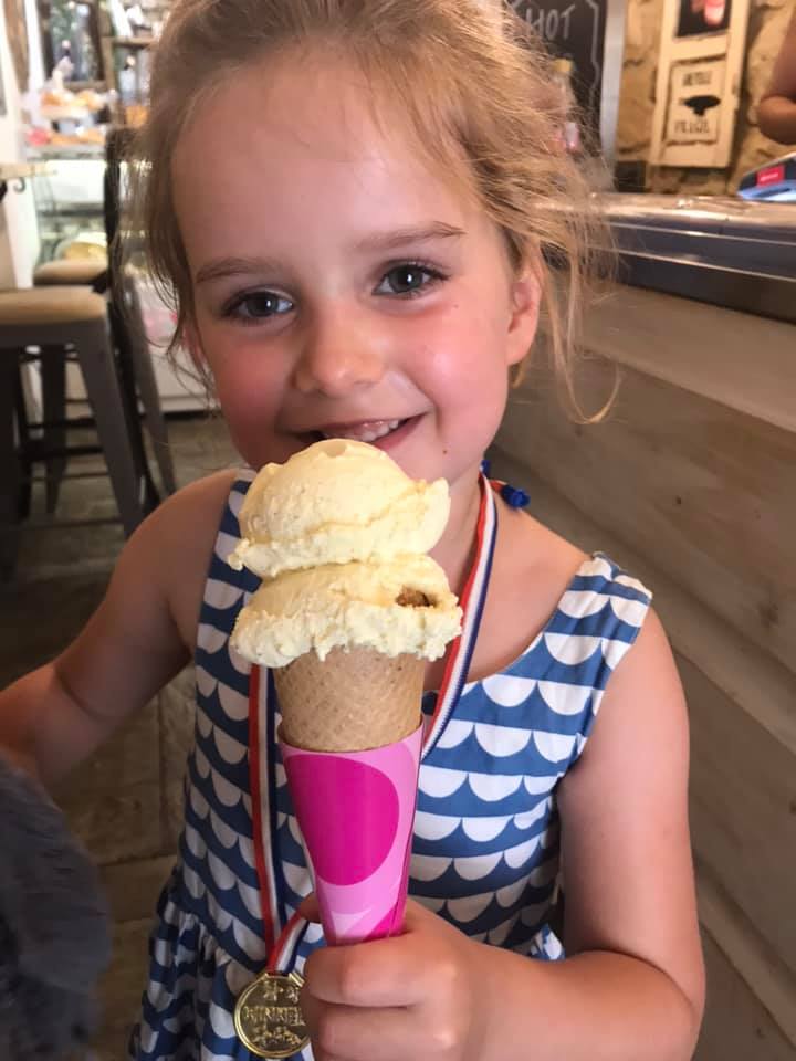 a girl eating an ice cream 