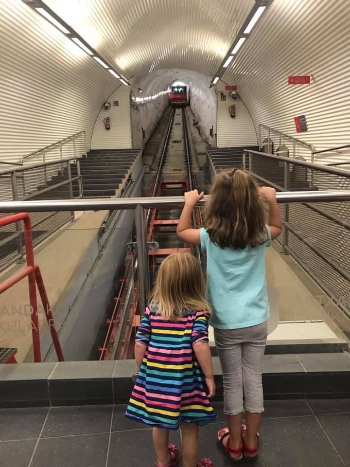 two girls waiting for the funicular in bilbao