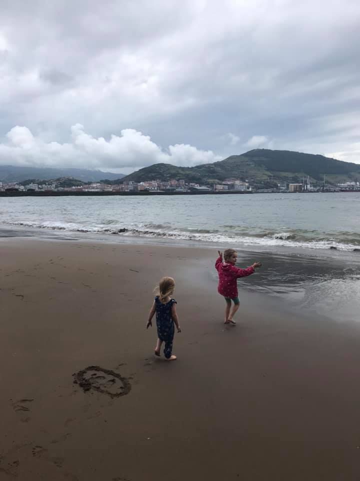 two girls playing on beach 