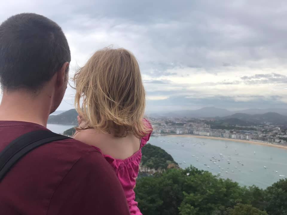 a dad and daughter watching view over san sebastian 