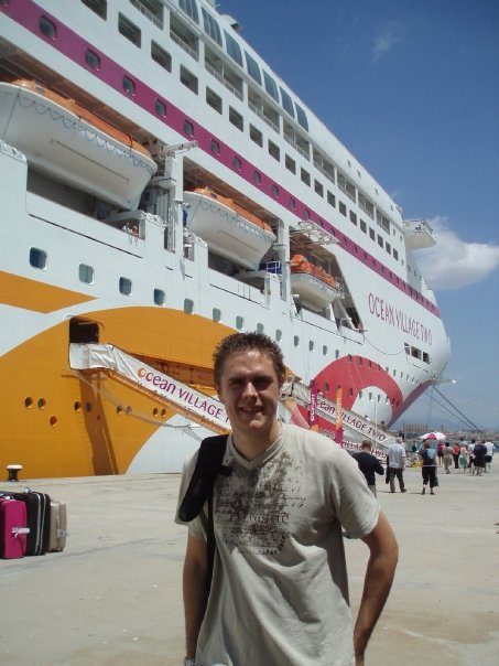 man in front of cruise liner 