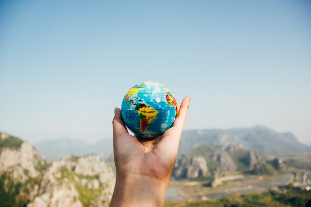 globe in someones hand