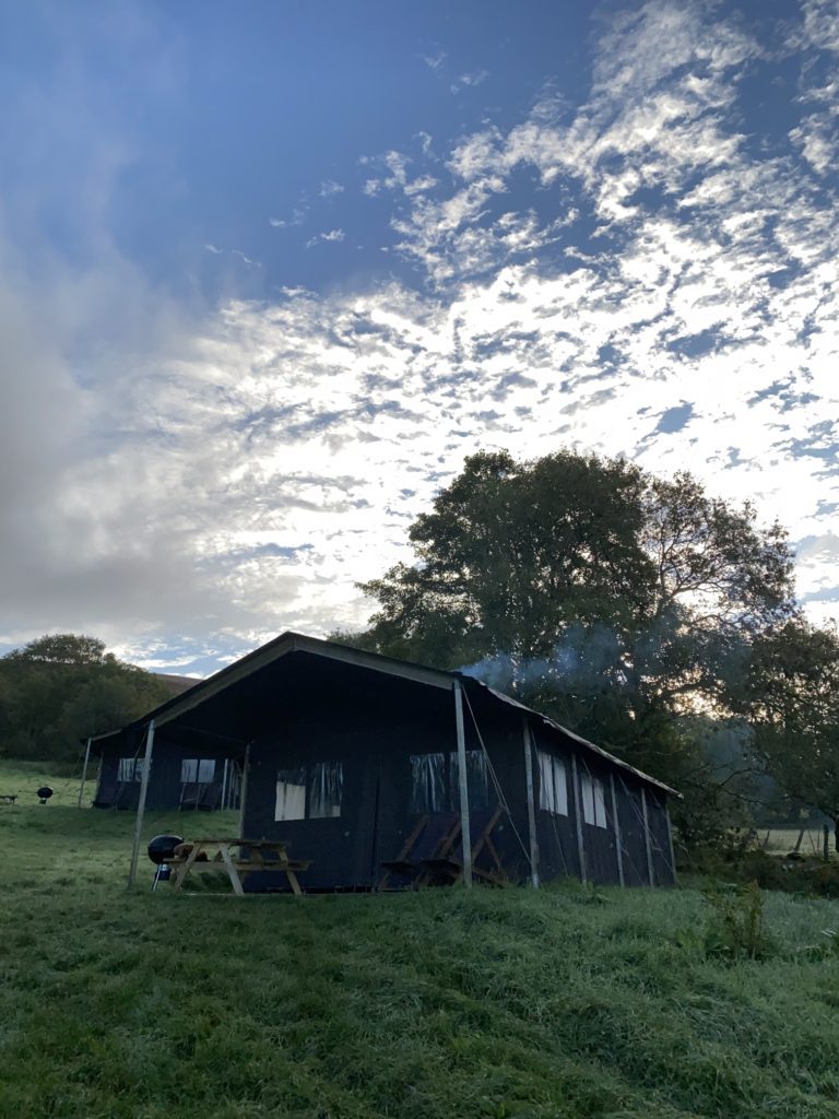 view of canvas frills glamping lodge at Cwmberach Farm at sunriseTRAVEL REVIEW - Glamping at Cwmberach Uchaf Farm with Feather Down