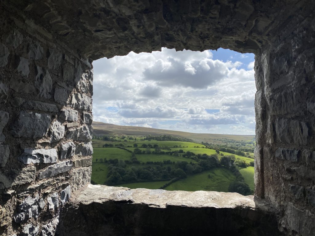 view of countryside from inside castle TRAVEL REVIEW - Glamping at Cwmberach Uchaf Farm with Feather Down