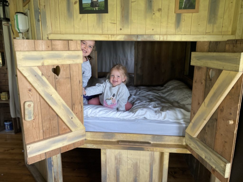 children in cupboard bed at Cwmberach Uchaf Farm with Feather Down Farms. TRAVEL REVIEW - Glamping at Cwmberach Uchaf Farm with Feather Down