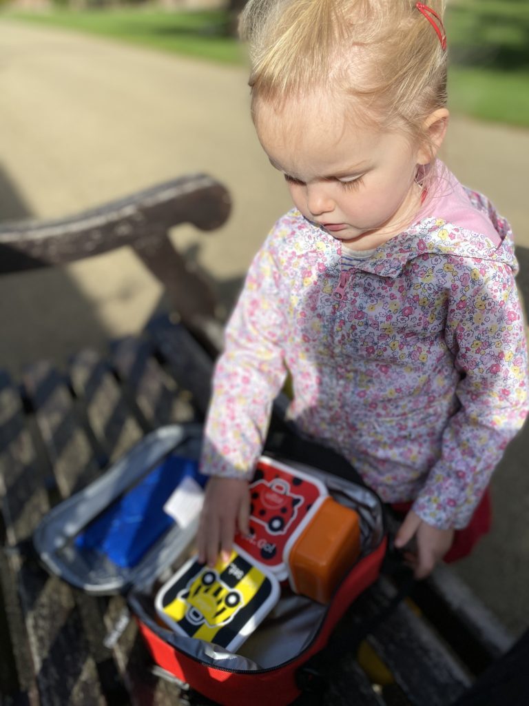 girl exploring trunki lunchbox