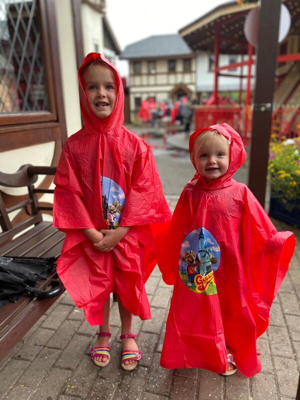 two girls in rain macs