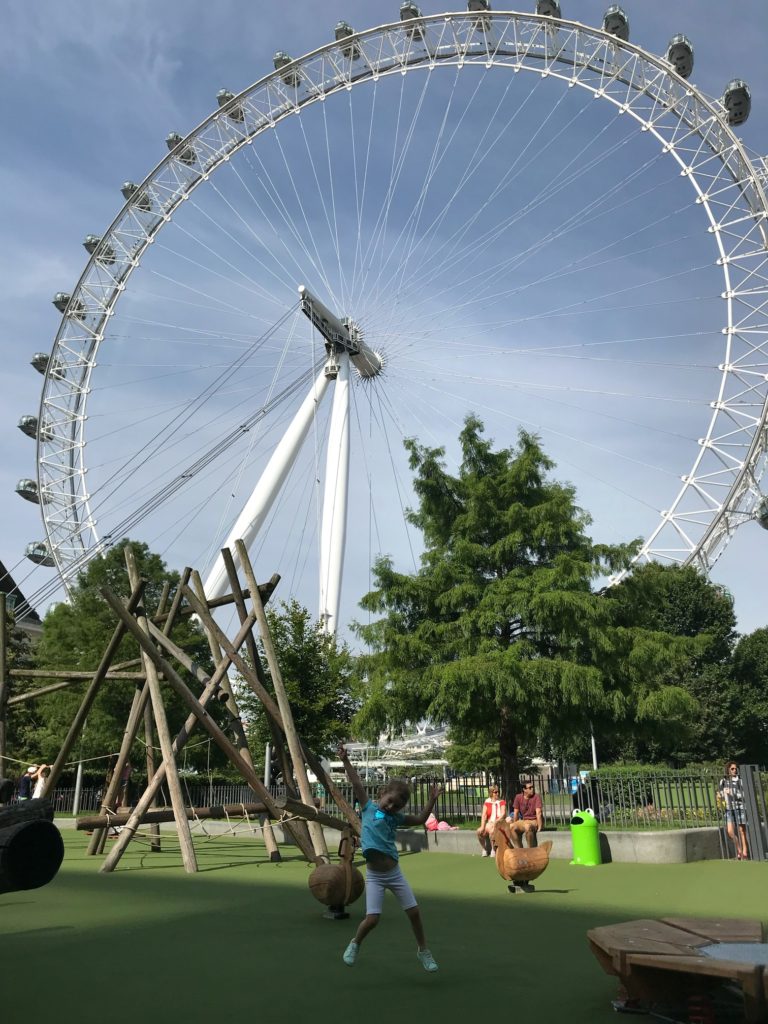 girl dancing in front of london eye