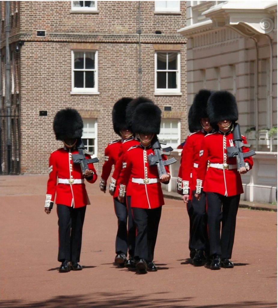 soldiers marching in black hats. The changing of the guard is a top free thing to in london with children