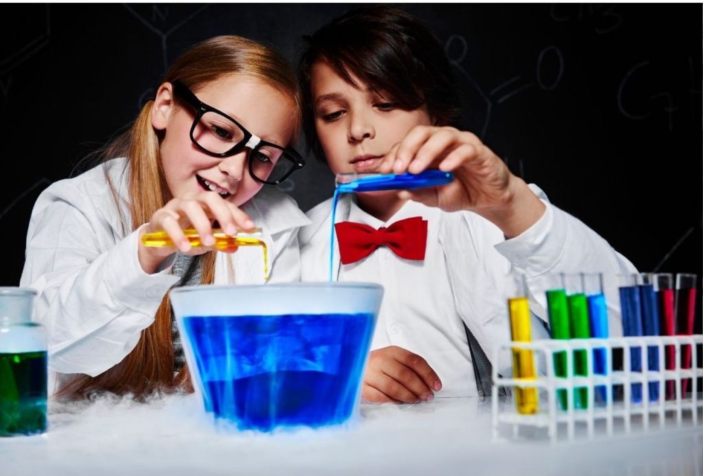 children playing at a chemistry set