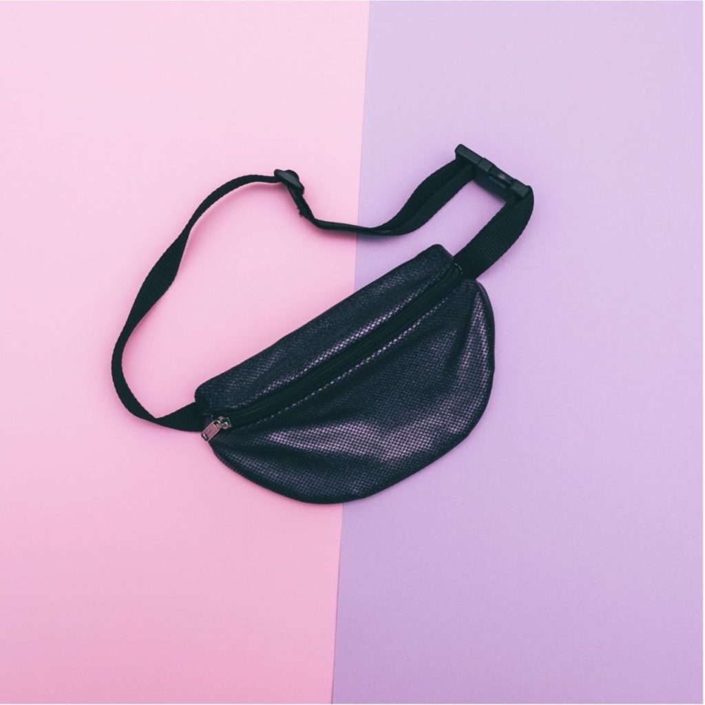 black bum bag on coloured background