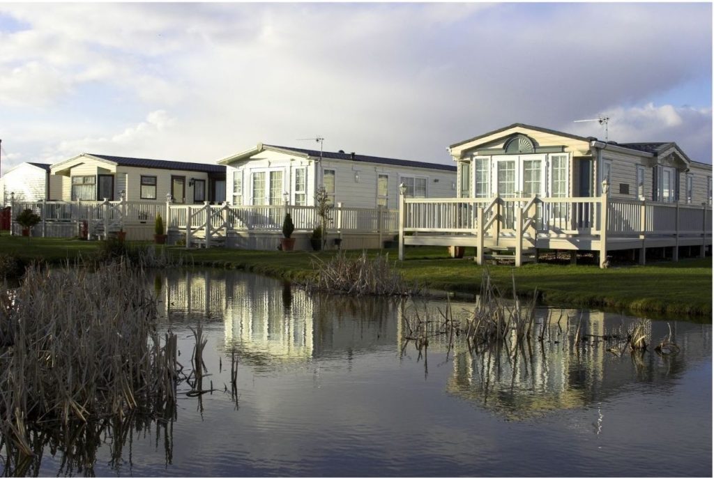 4 static homes on the edge of a lake .How to save money by using Tesco Club Card Points for travel, holidays and day trips