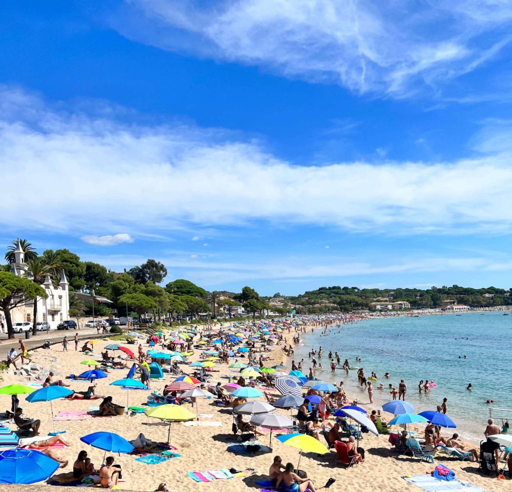 Sant Feliu de Guixols. Beautiful beach with beach umbrellas 