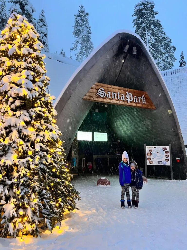 children outside Santa park in lapland 