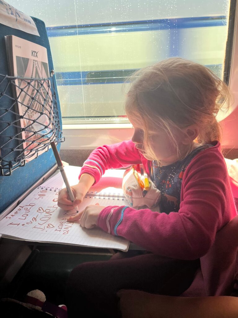 girl doing activities on plane 